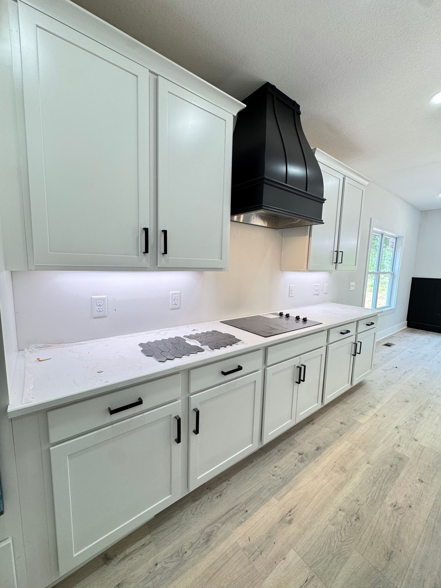 1725 Powell Road Clarksville, TN 37043 - Photo 9 of 42 a kitchen with stainless steel appliances a sink dishwasher and a stove with wooden floor
