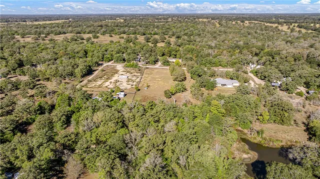 an aerial view of residential house with outdoor space