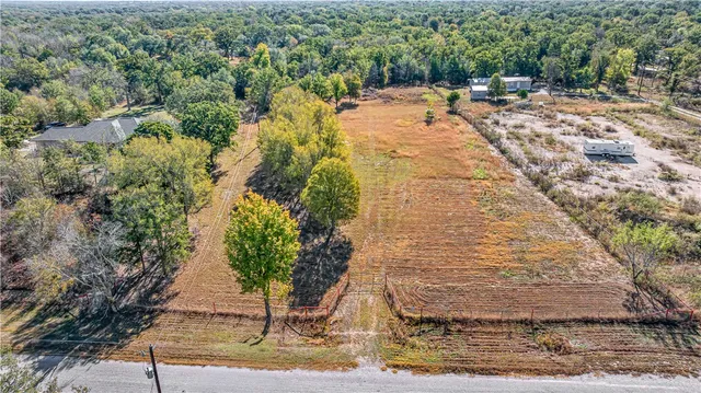 a view of yard with swimming pool and trees
