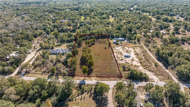 an aerial view of residential house with parking space