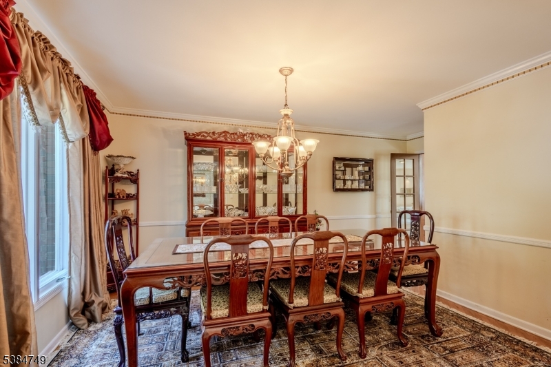 85 Swenson Circle Berkeley Heights, NJ 07922 - Photo 14 of 47 a view of a dining room with furniture and chandelier