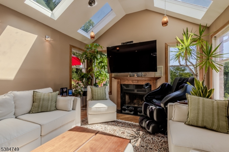 85 Swenson Circle Berkeley Heights, NJ 07922 - Photo 17 of 47 a living room with furniture and a flat screen tv