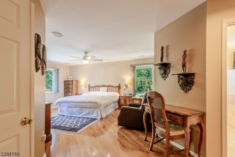 85 Swenson Circle Berkeley Heights, NJ 07922 - Photo 22 of 47 a bedroom with a bed and wooden floor