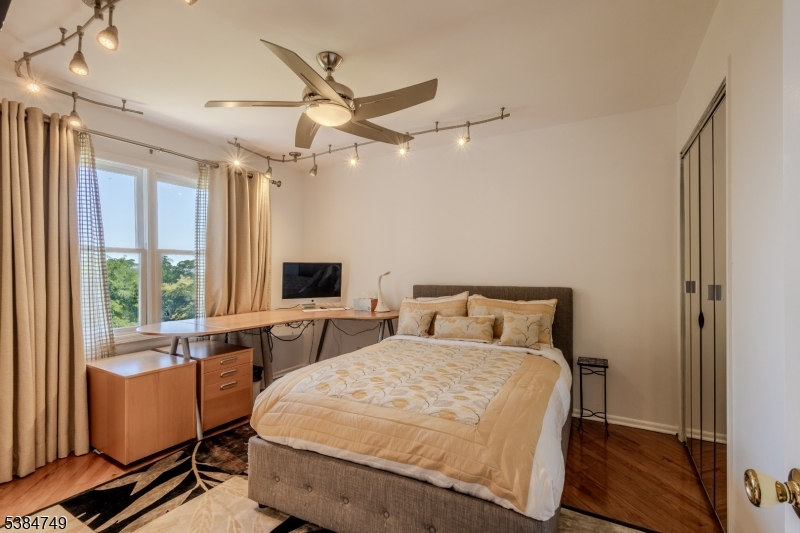 85 Swenson Circle Berkeley Heights, NJ 07922 - Photo 29 of 47 a bedroom with a bed wooden floor and window