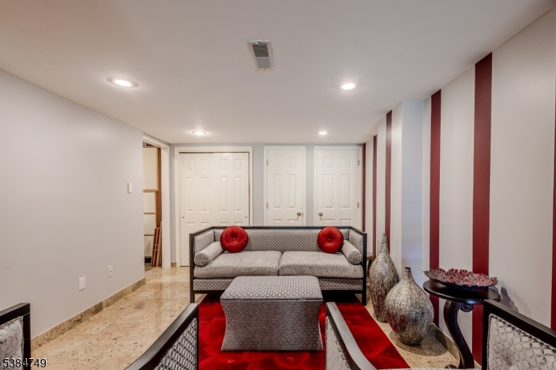 85 Swenson Circle Berkeley Heights, NJ 07922 - Photo 34 of 47 a living room with furniture and a flat screen tv