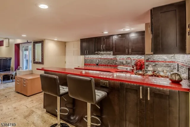 a kitchen with a table and chairs in it