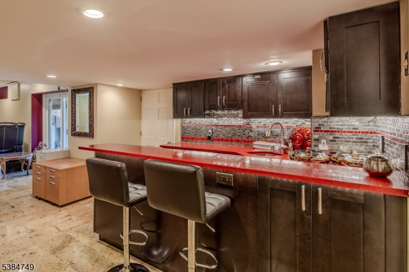 85 Swenson Circle Berkeley Heights, NJ 07922 - Photo 35 of 47 a kitchen with a table and chairs in it