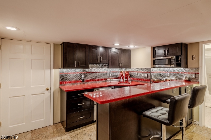 85 Swenson Circle Berkeley Heights, NJ 07922 - Photo 36 of 47 a kitchen with stainless steel appliances granite countertop a sink and cabinets