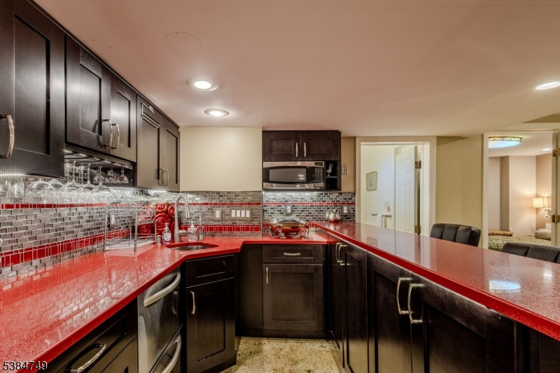 85 Swenson Circle Berkeley Heights, NJ 07922 - Photo 37 of 47 a kitchen with lots of counter space and stainless steel appliances