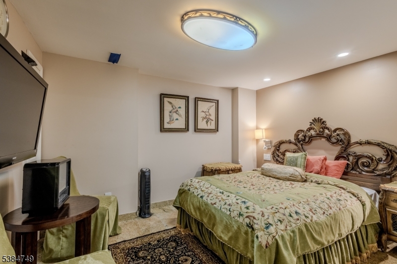 85 Swenson Circle Berkeley Heights, NJ 07922 - Photo 39 of 47 a bedroom with a bed and a flat screen tv