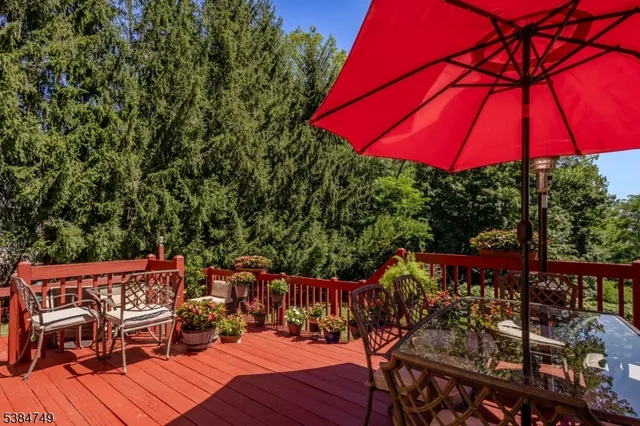 swimming pool with outdoor seating and wooden floor