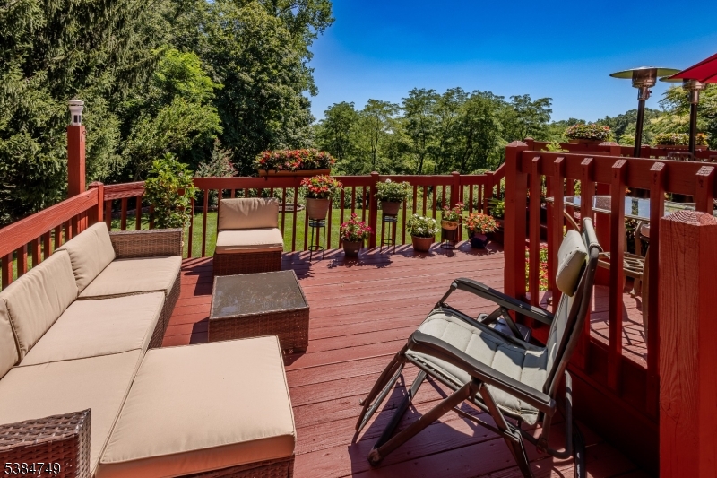 85 Swenson Circle Berkeley Heights, NJ 07922 - Photo 42 of 47 a view of a patio with lawn chairs fire pit and outdoor seating