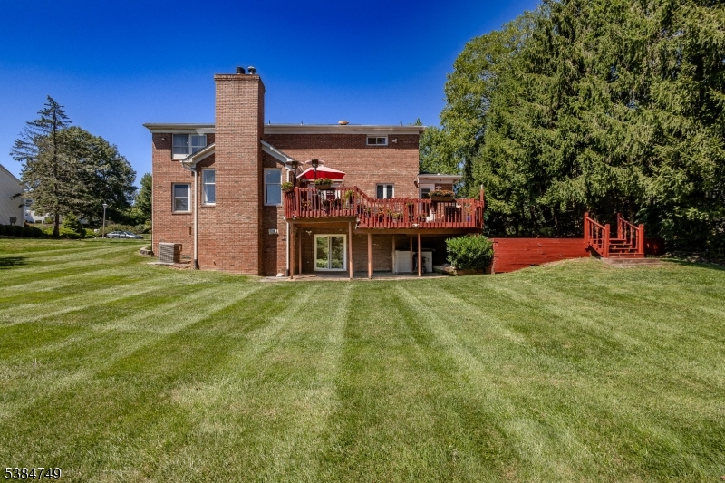85 Swenson Circle Berkeley Heights, NJ 07922 - Photo 46 of 47 a view of a big house with a big yard and large trees