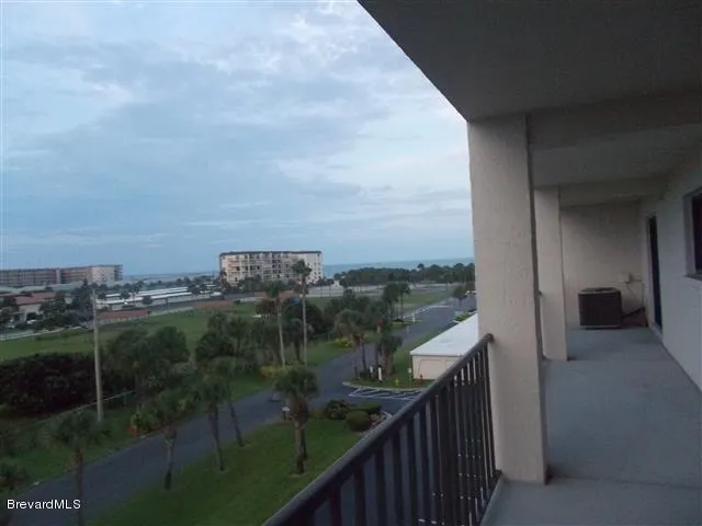 a room with a refrigerator and cabinets
