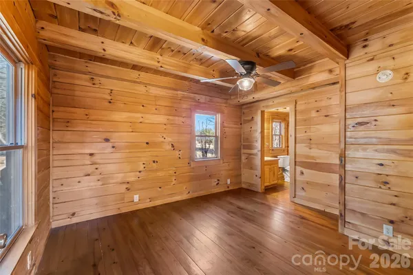 a view of an empty room and wooden floor