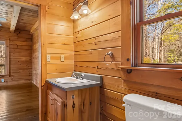 a bathroom with a sink and a window
