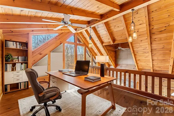 a work room with furniture and stairs