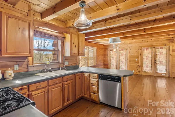 a kitchen that has a sink and a stove