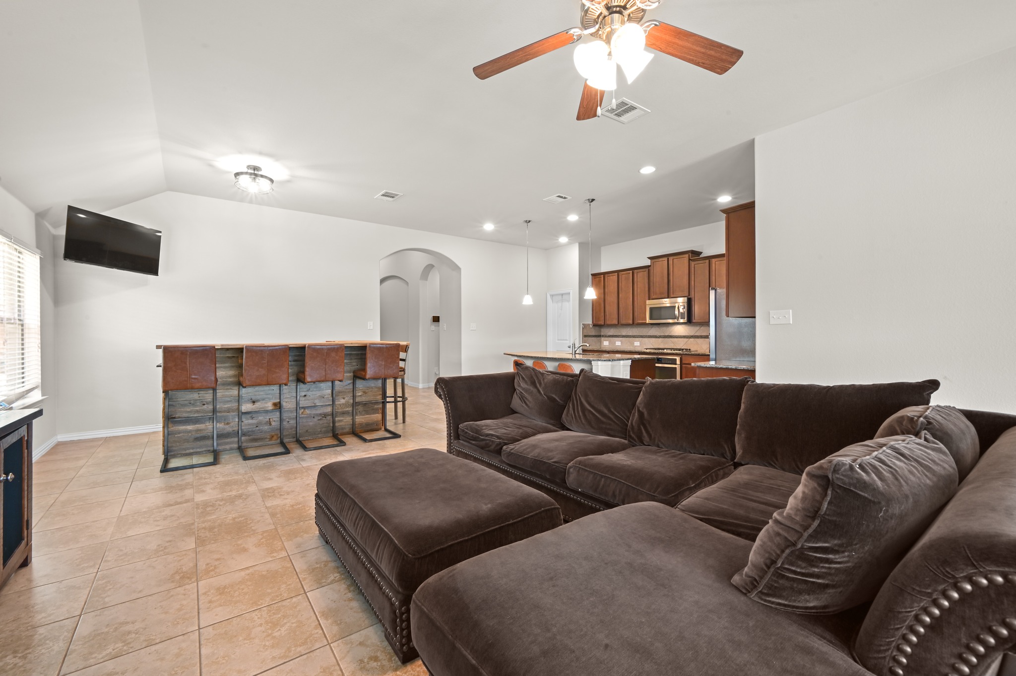 877 Hot Spring Valley Buda, TX 78610 - Photo 11 of 36 a living room with furniture a glass table and chairs