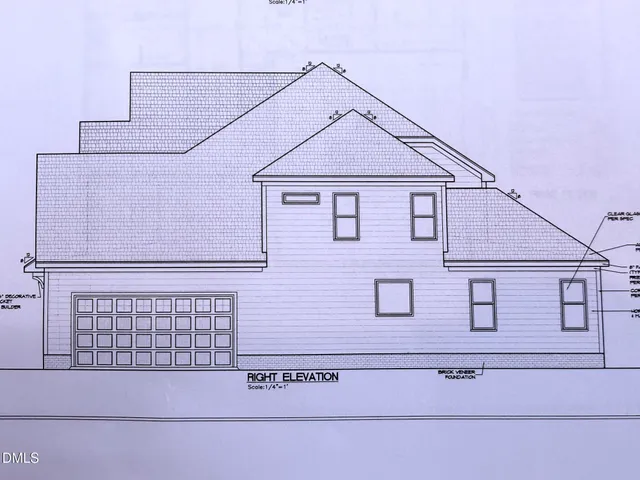 a view of a house with large windows