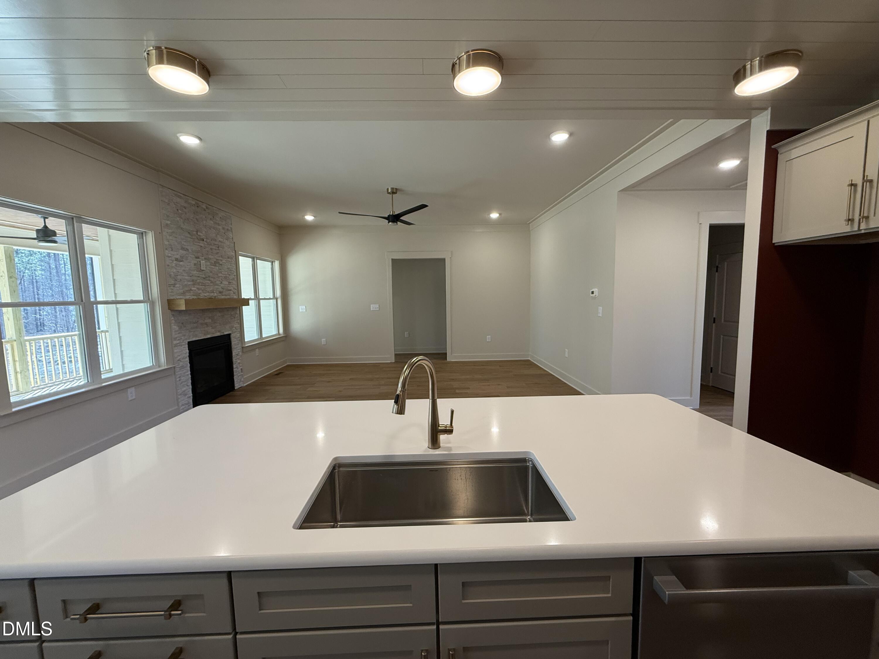 12601 Burgess Road Middlesex, NC 27557 - Photo 12 of 27 a kitchen with a sink and a refrigerator