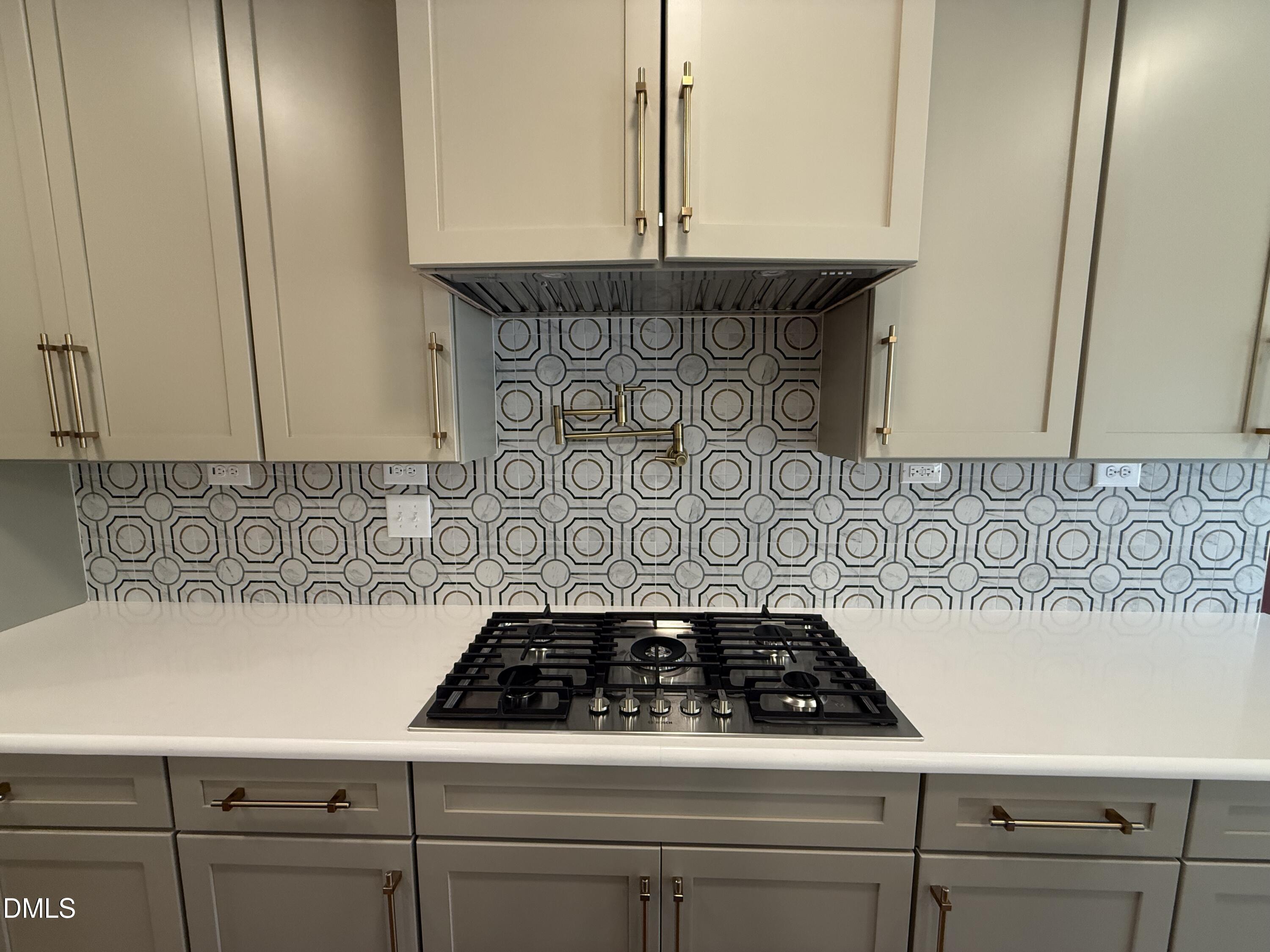 12601 Burgess Road Middlesex, NC 27557 - Photo 13 of 27 a stove top oven sitting inside of a kitchen