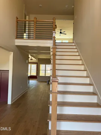 a view of entryway and hall with wooden floor