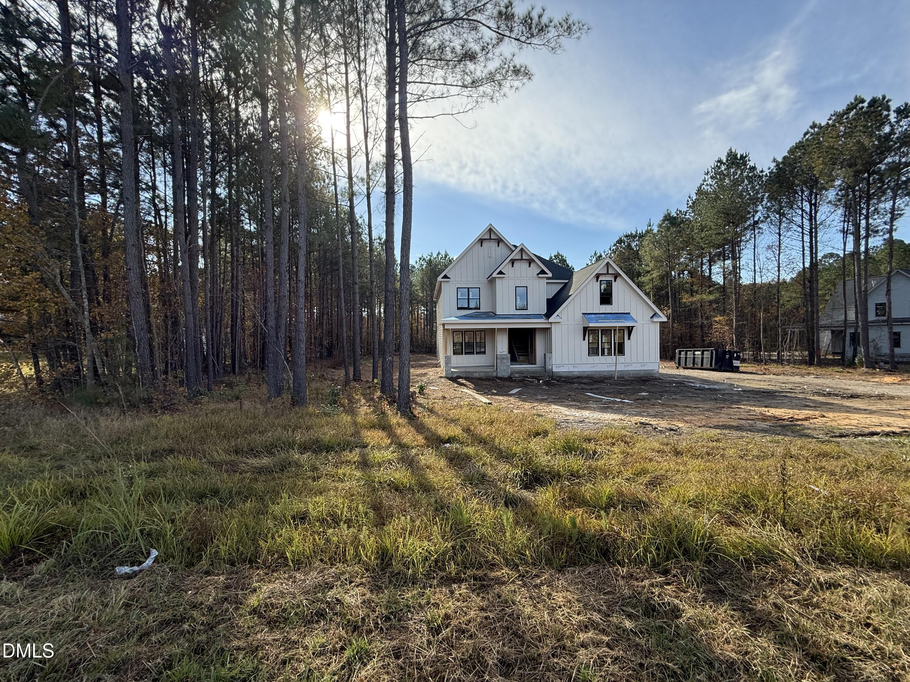 12601 Burgess Road Middlesex, NC 27557 - Photo 4 of 13 a view of house with backyard and tree