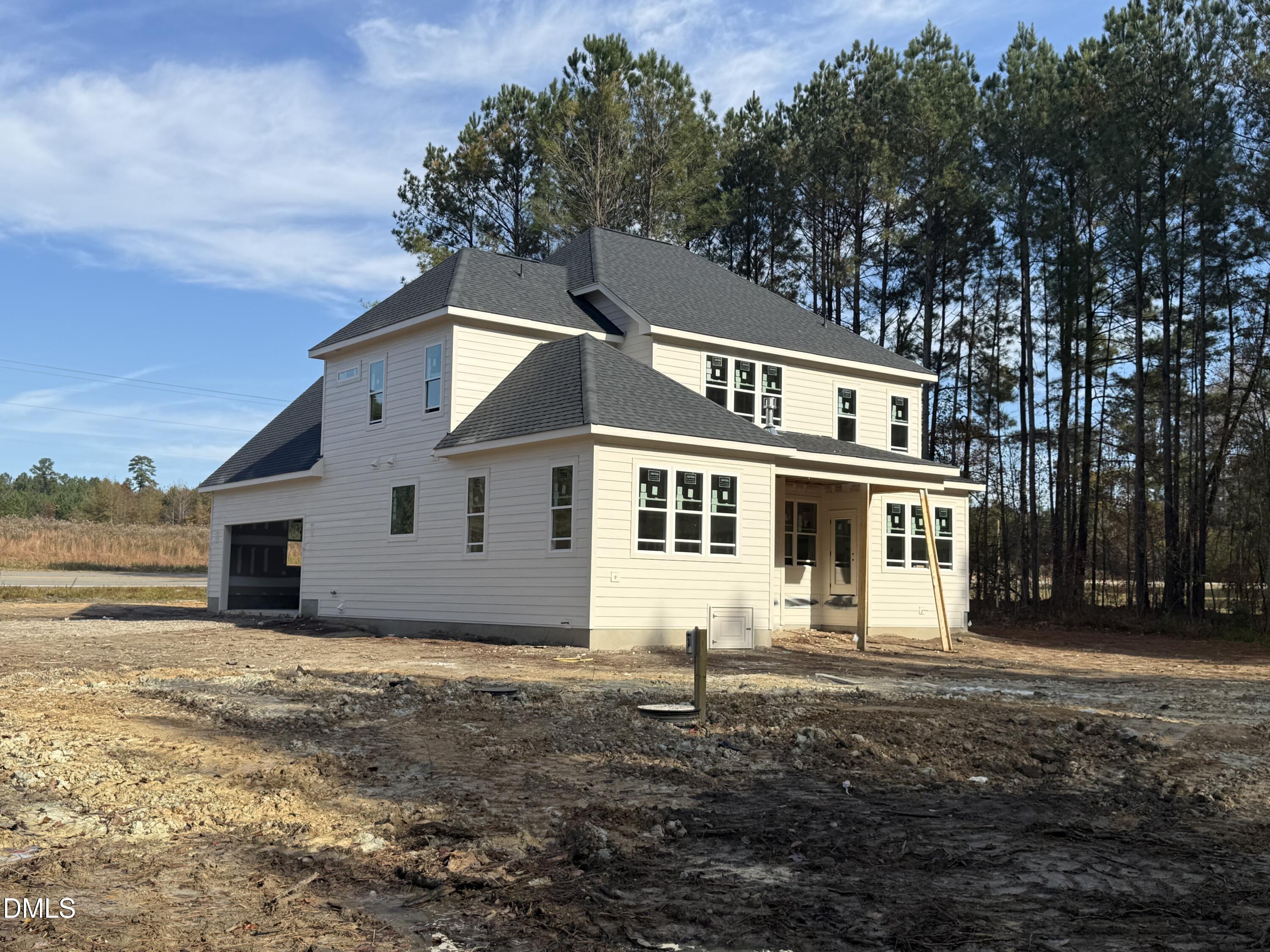 12601 Burgess Road Middlesex, NC 27557 - Photo 6 of 13 a front view of a house with a yard