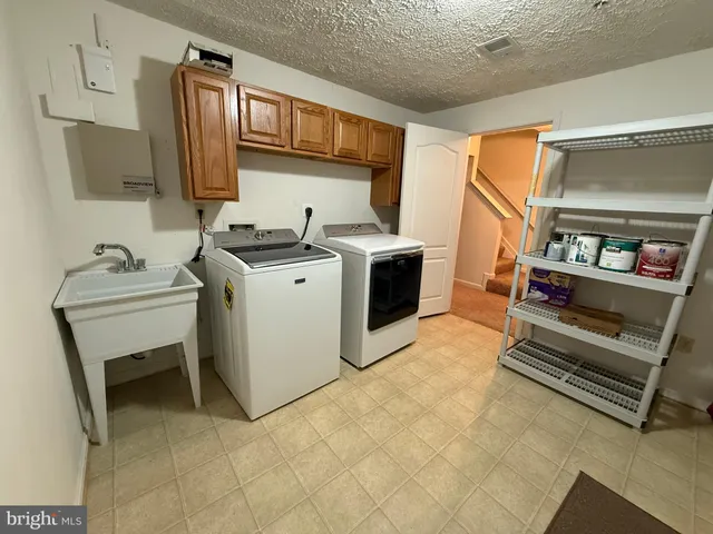 a room with furniture and white walls