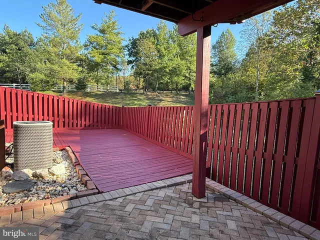 a front view of a house with sitting area