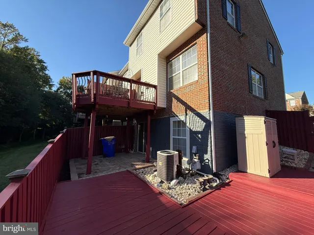 a view of a backyard with sitting area