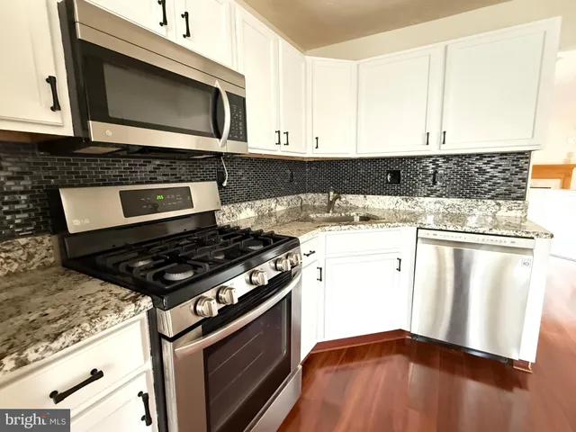 a kitchen with a stove and a microwave