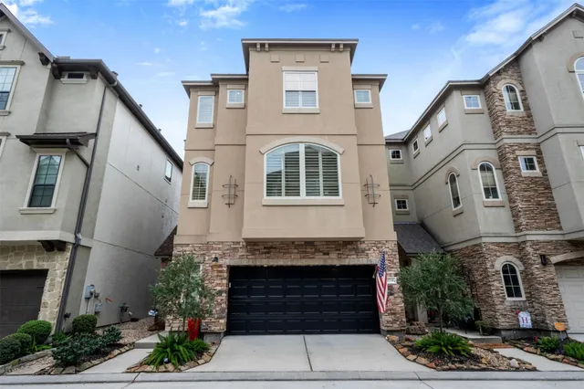 a front view of a house with a garage