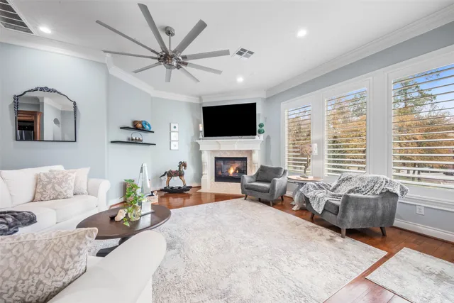a living room with furniture fireplace and a flat screen tv