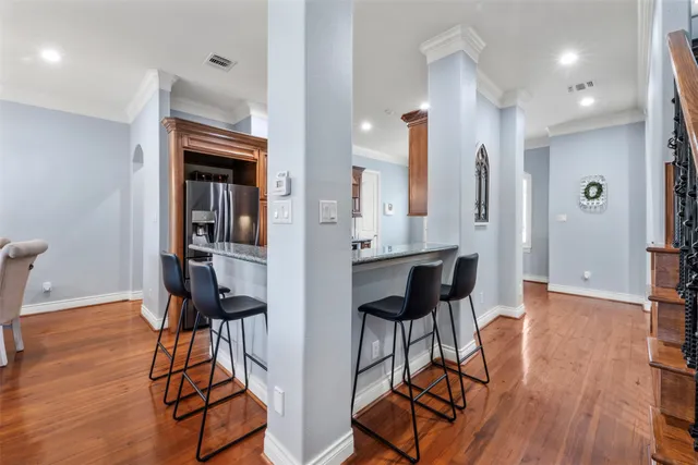 a view of kitchen with furniture and wooden floor