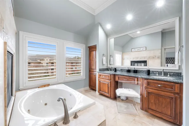 a large white kitchen with a large window