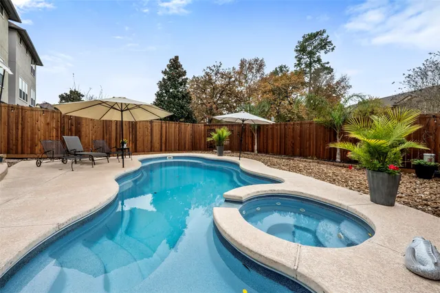 a swimming pool with outdoor seating