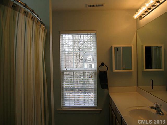 10410 Caldwell Depot Road Cornelius, NC 28031 - Photo 11 of 15 a bathroom with a granite countertop sink and a mirror