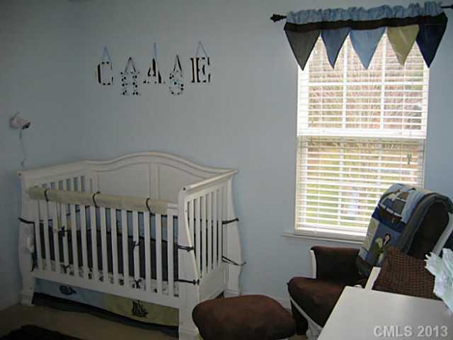 10410 Caldwell Depot Road Cornelius, NC 28031 - Photo 12 of 15 a view of a bedroom with furniture and windows