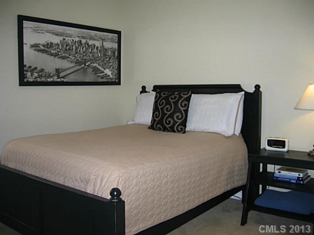 10410 Caldwell Depot Road Cornelius, NC 28031 - Photo 14 of 15 a bedroom with a bed and wall painting