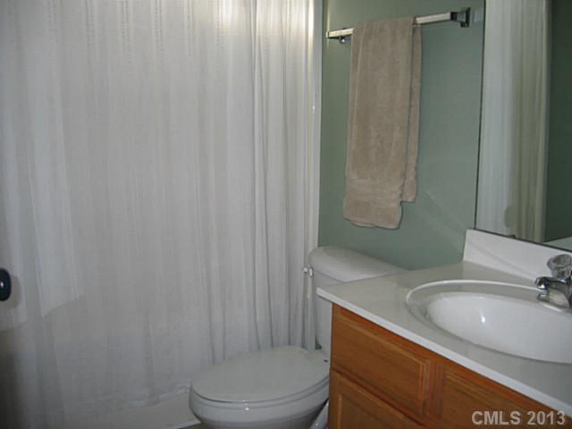 10410 Caldwell Depot Road Cornelius, NC 28031 - Photo 15 of 15 a bathroom with a sink toilet and shower