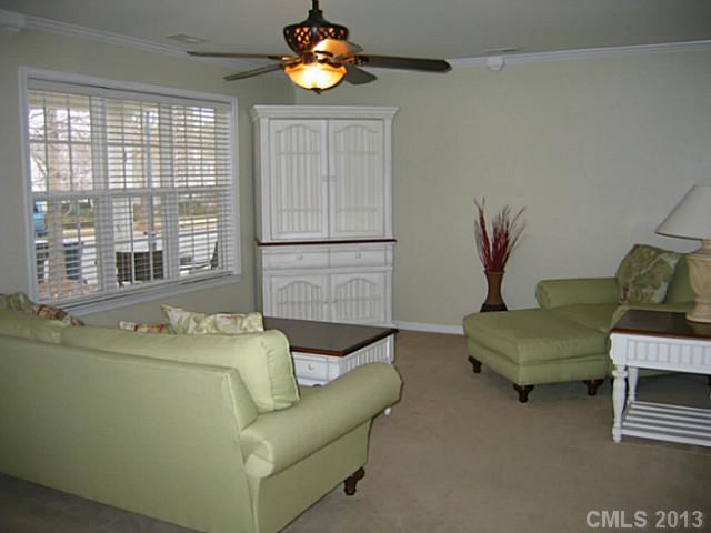 10410 Caldwell Depot Road Cornelius, NC 28031 - Photo 5 of 15 a living room with furniture and a window