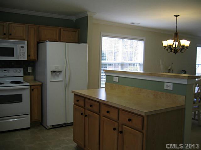 10410 Caldwell Depot Road Cornelius, NC 28031 - Photo 7 of 15 a kitchen with a refrigerator and a sink