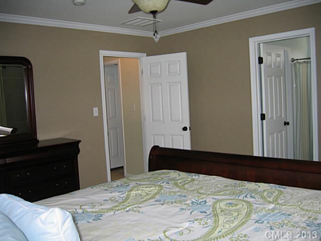10410 Caldwell Depot Road Cornelius, NC 28031 - Photo 9 of 15 a bedroom with a bed and a dresser
