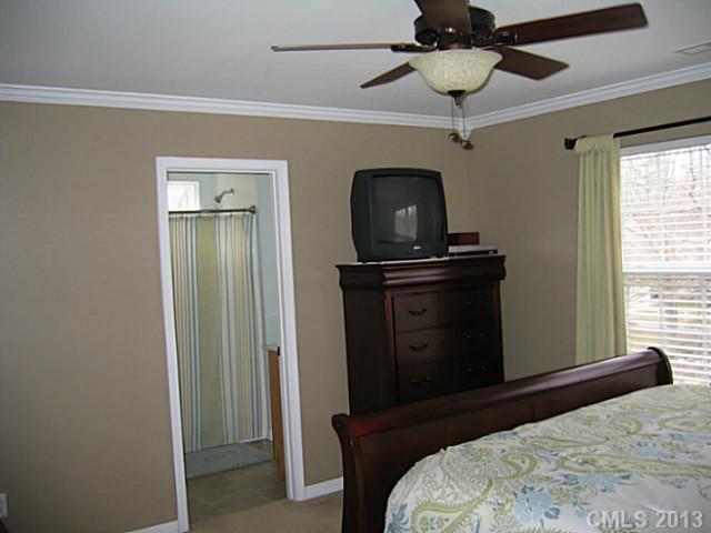 10410 Caldwell Depot Road Cornelius, NC 28031 - Photo 10 of 15 a bedroom with a bed and a window