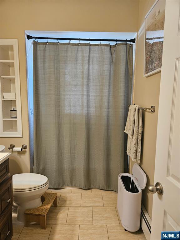 15 William Street, Unit 2 Rochelle Park, NJ 07662 - Photo 6 of 12 a bathroom with a sink and a toilet