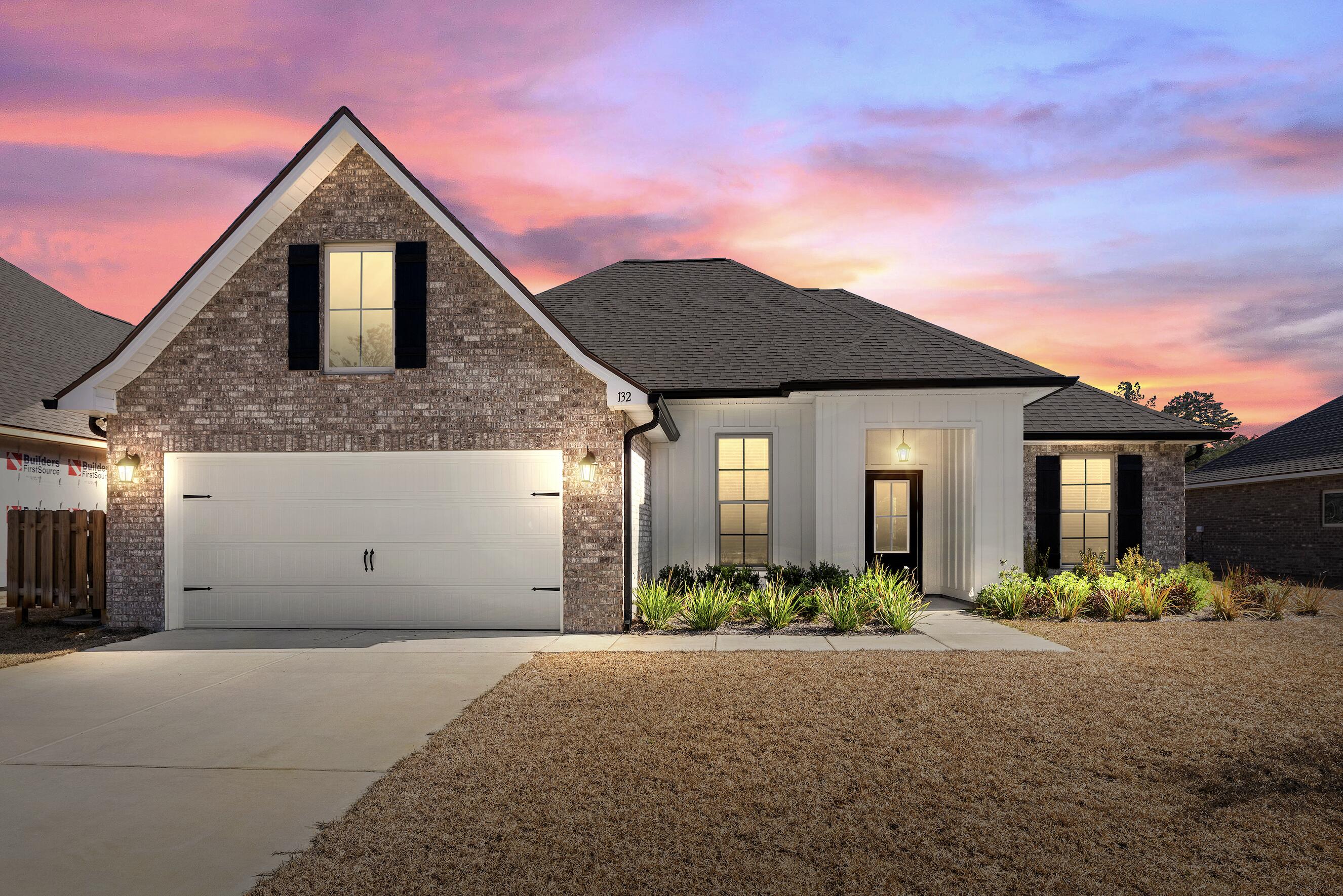 132 East Tweet Street Freeport, FL 32439 - Photo 1 of 79 a front view of a house with a yard and garage