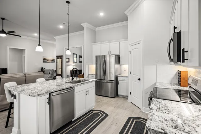 a bathroom with a sink a mirror and a vanity