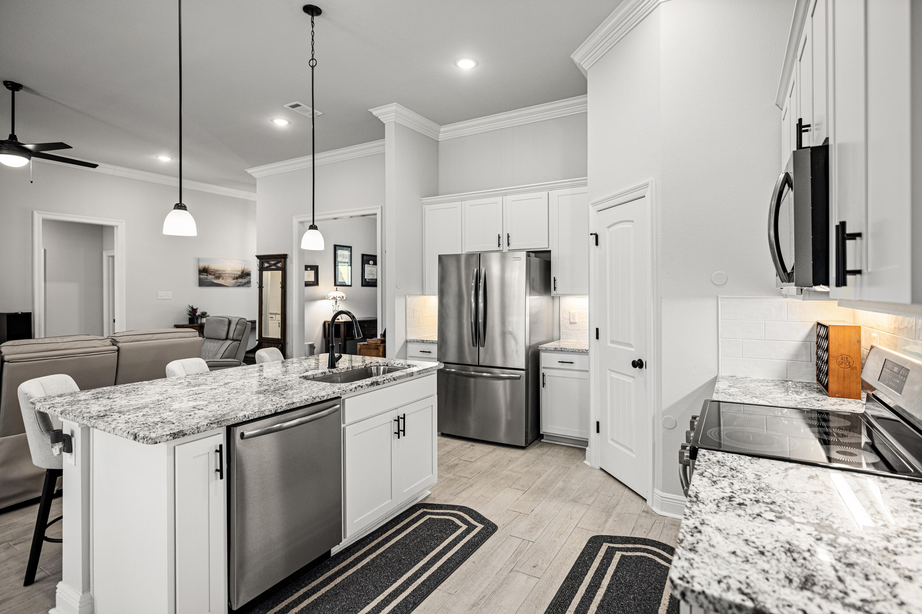 132 East Tweet Street Freeport, FL 32439 - Photo 15 of 79 a kitchen with stainless steel appliances granite countertop a sink stove and refrigerator